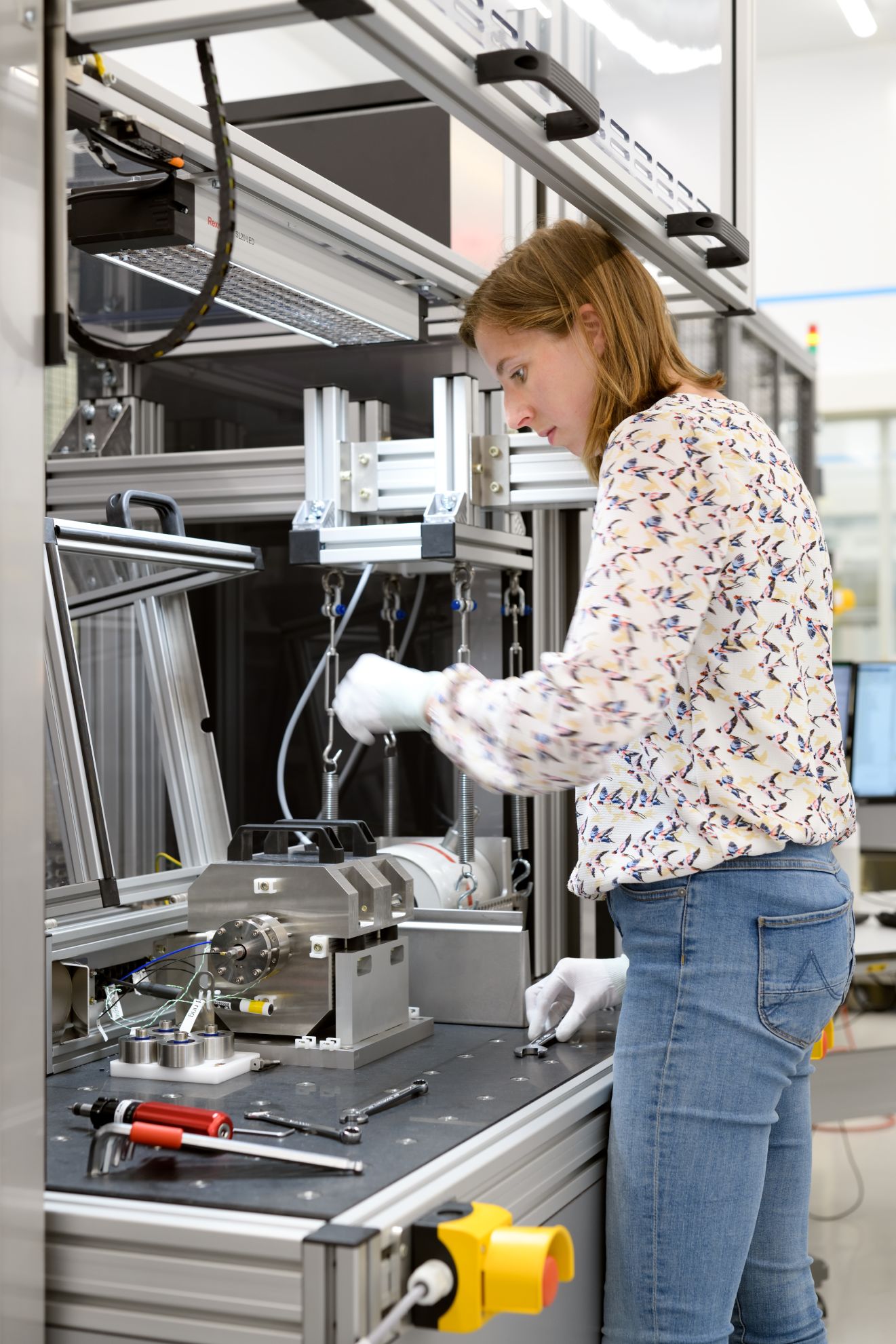An ASML employee tests mechanics. An ASML employee tests mechanics.