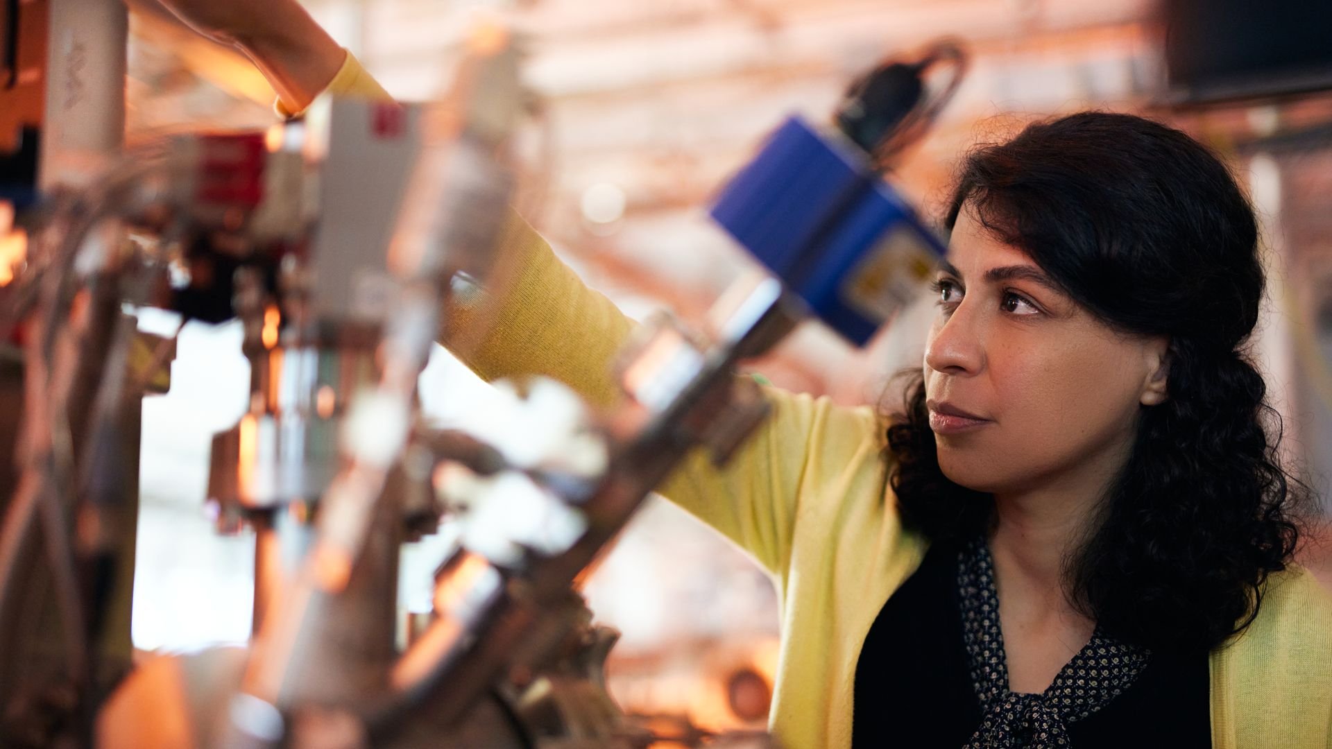Woman working on an ASML machine