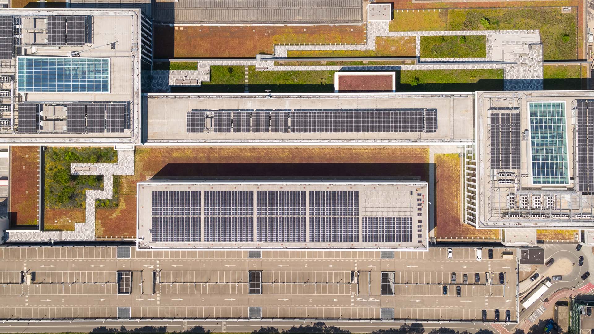 Ariel view of Building 6 KLM featuring a rooftop garden and solar panels. Ariel view of Building 6 KLM featuring a rooftop garden and solar panels.