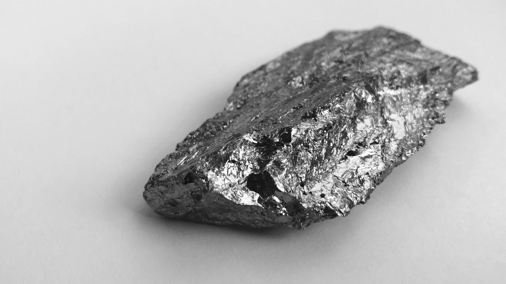 Silicon oxide rock sitting on flat surface Silicon oxide rock sitting on flat surface